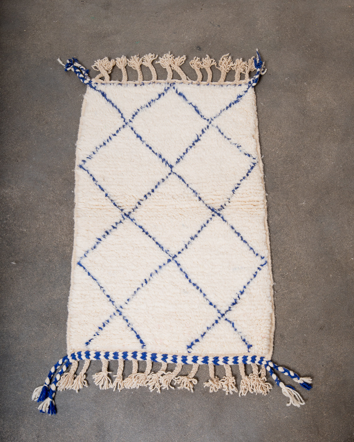 Modern, designer, handcrafted Berber rug from Morocco. Beniourain carpet with beautiful colours and patterns and fluffy wool texture.